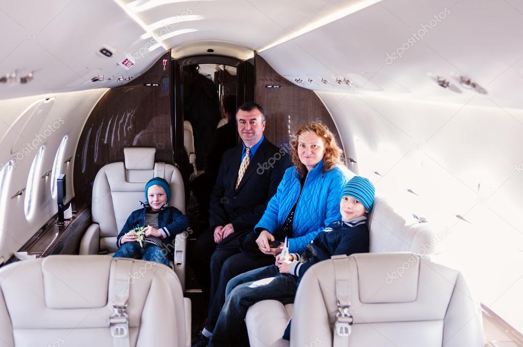 Family traveling by commercial air jet