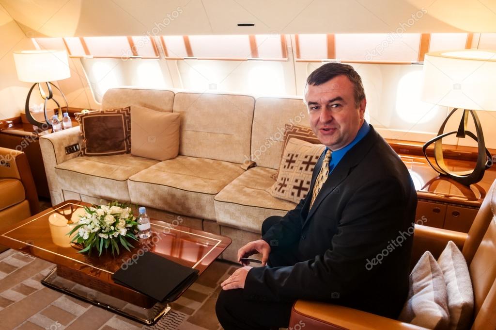 Businessman traveling by commercial air jet