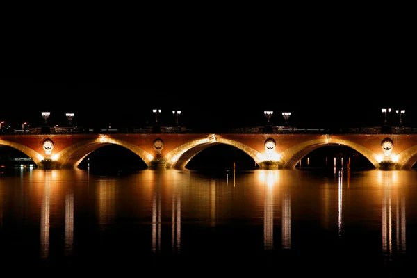 Night view of The Pont de pierre (Stone Bridge) (1819-1822), Bor — Stock Photo, Image