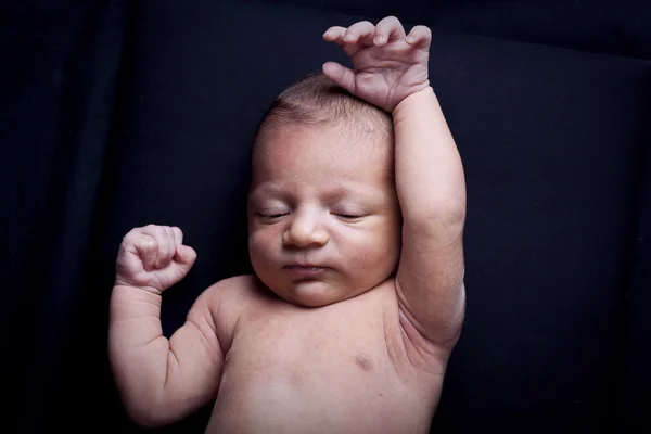 Portrait of adorable newborn baby girl on black background — Stock Photo, Image