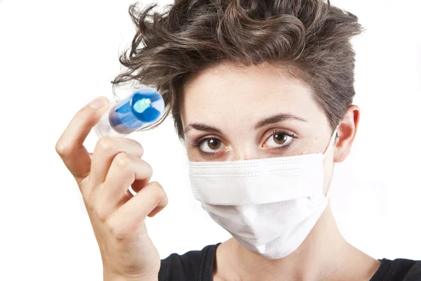 Young pretty nurse in mask with syringe — Stock Photo, Image