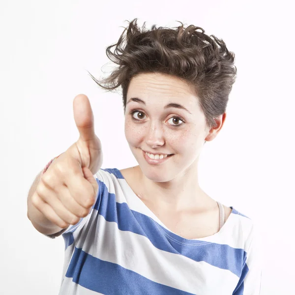 Joyeux sourire fille avec les pouces vers le haut geste, isolé sur fond blanc — Photo