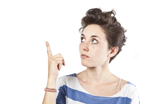 Portrait of a happy young beautiful woman pointing at something — Stock Photo, Image