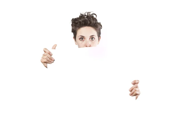 Beautiful young girl holding an empty white poster — Stock Photo, Image