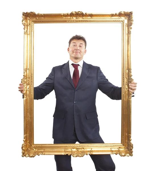 Porträtt av affärsmannen innehar en gyllene ram på vit bakgrund — Stockfoto