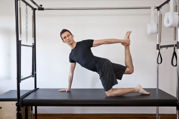 Man practicing pilates — Stock Photo, Image