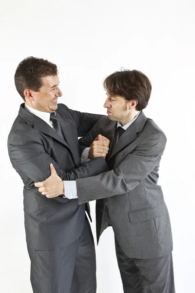 Twee zakenlieden gelukkig zien elkaar geïsoleerd op wit — Stockfoto