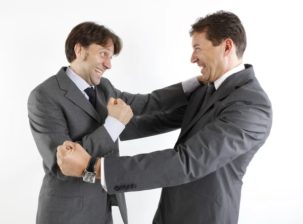 Två affärsmän glad se varandra isolerade på vit — Stockfoto