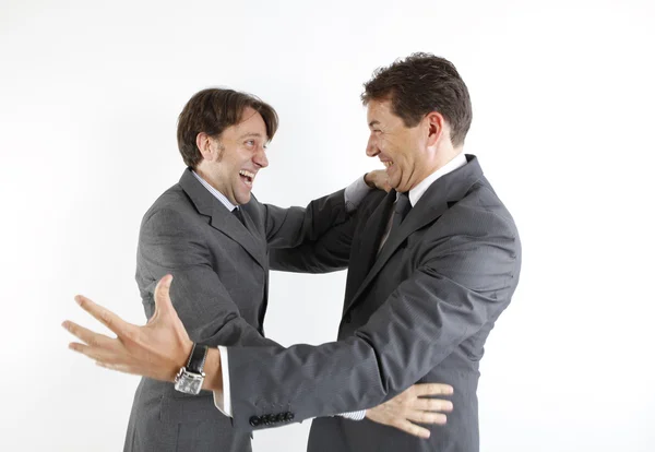 Dois homens de negócios felizes vendo um ao outro isolado em branco — Fotografia de Stock