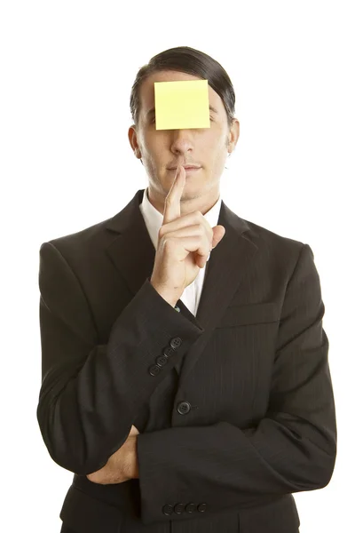 Young man with blank note on the face — Stock Photo, Image