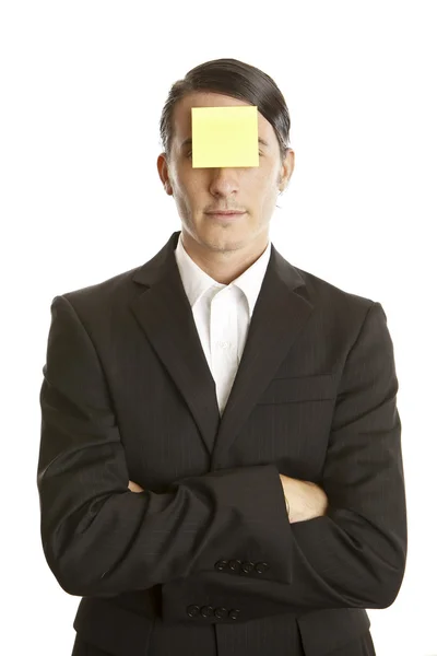 Young man with blank note on the face — Stock Photo, Image