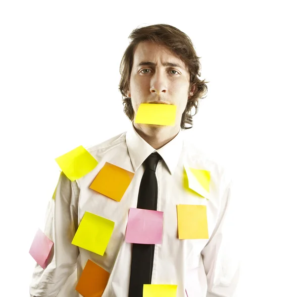 Young man covered by notes — Stock Photo, Image
