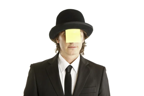 Homem com nota em branco no rosto com chapéu — Fotografia de Stock