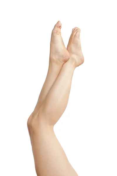 Belas pernas de mulher jovem isolado no branco — Fotografia de Stock