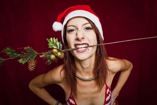 Rock style christmas girl over red background — Stock Photo, Image