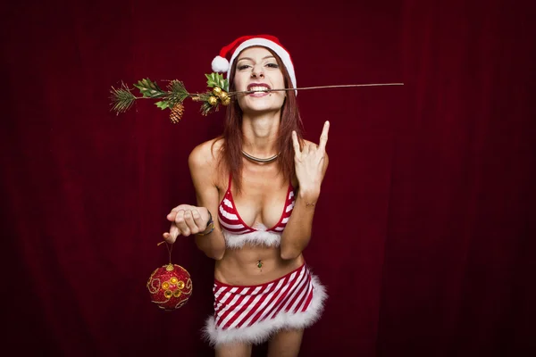 Rock style christmas girl over red background — Stock Photo, Image