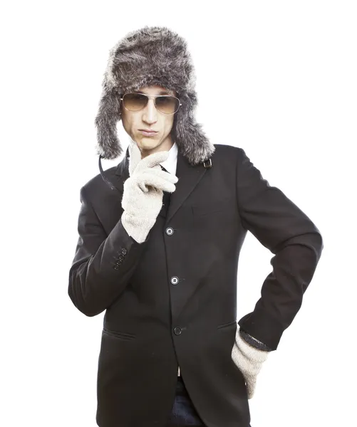 Attractive young man wearing elegant black suit,sunglasses and russian hat — Stock Photo, Image