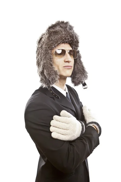 Attractive young man wearing elegant black suit,sunglasses and russian hat — Stock Photo, Image