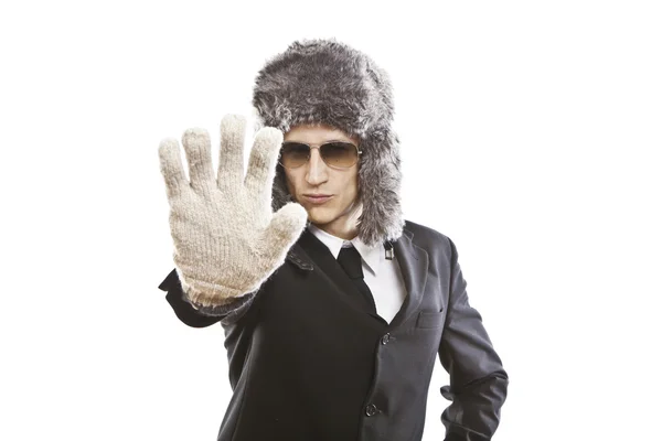 Attractive young man wearing elegant black suit,sunglasses and russian hat — Stock Photo, Image