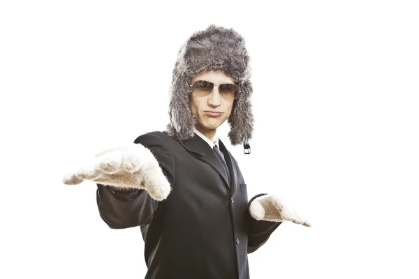 Attractive young man wearing elegant black suit,sunglasses and russian hat — Stock Photo, Image