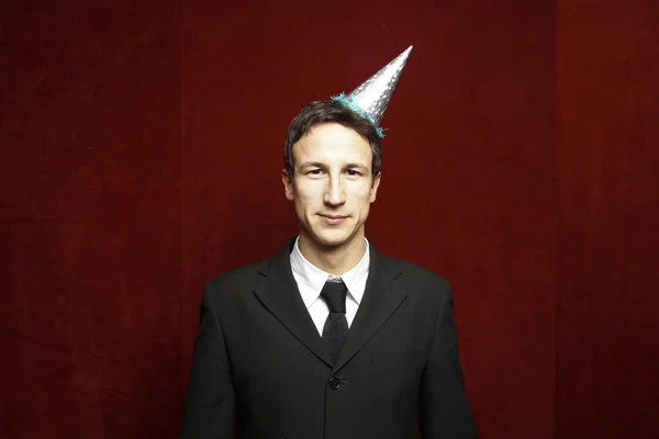 Homem de negócios engraçado com chapéu de festa — Fotografia de Stock