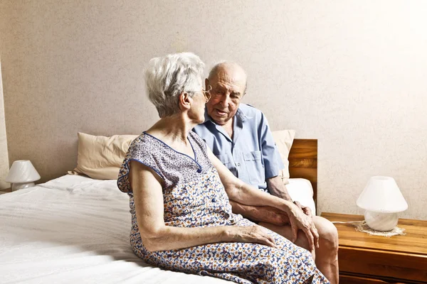 Elderly couple in the bedroom — Stock Photo, Image