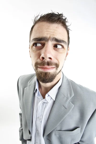 Crazy young businessman facial expressions — Stock Photo, Image