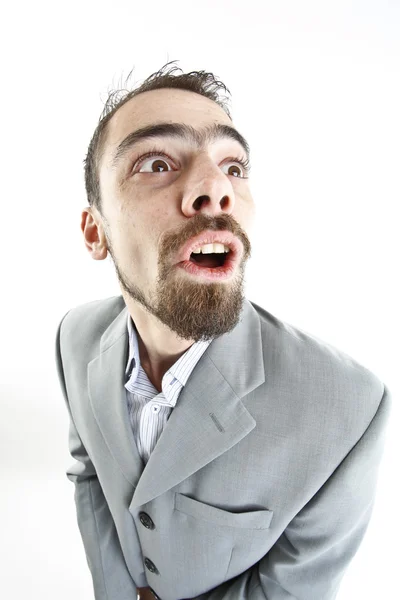 Crazy young businessman facial expressions — Stock Photo, Image