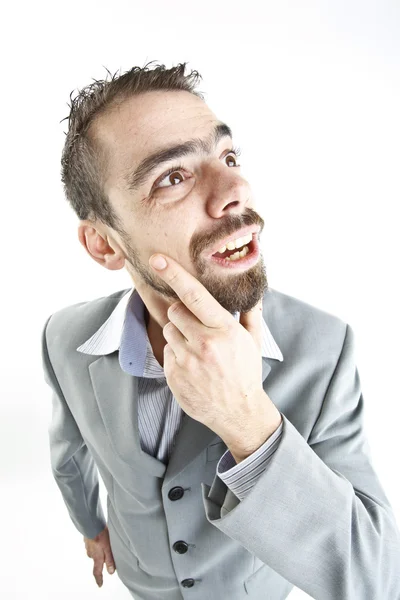 Crazy young businessman facial expressions — Stock Photo, Image