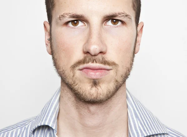 Young man's face, serious expression — Stock Photo, Image