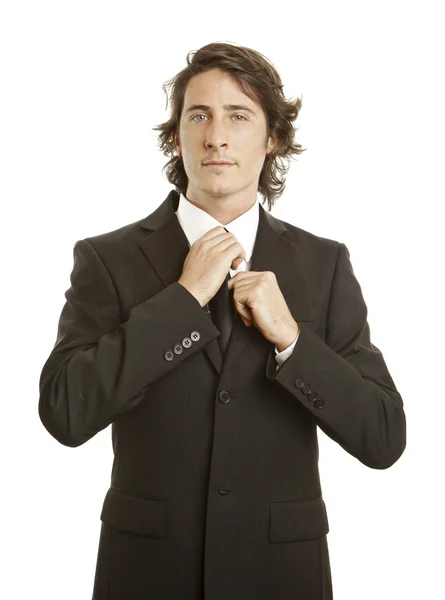 Confident young businessman against white background Stock Photo