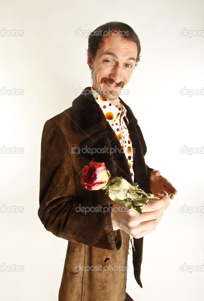 Young handsome guy with rose