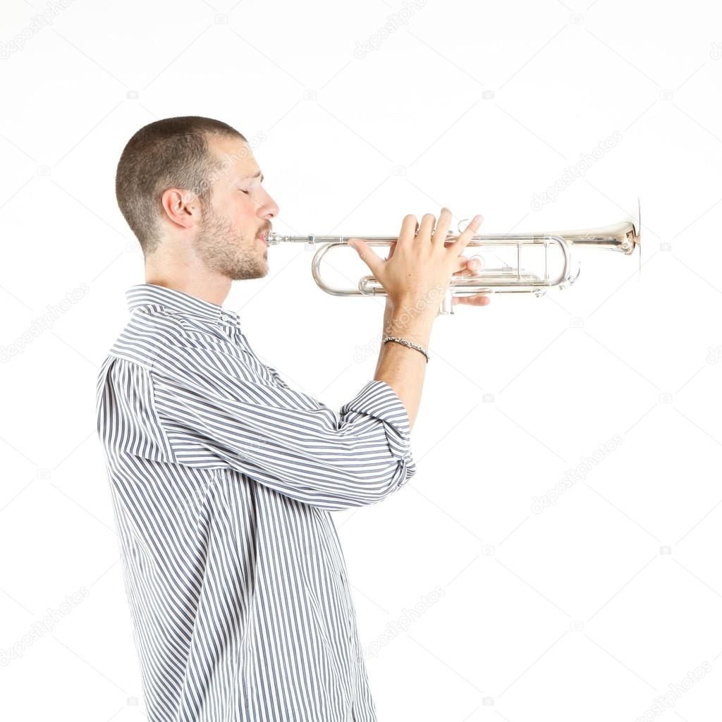 Young hansome man playing trumpet Stock Photo by ©tommasolizzul 13764651