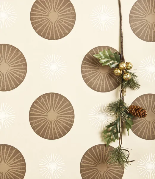 christmas branch decoration on funky wallpaper background