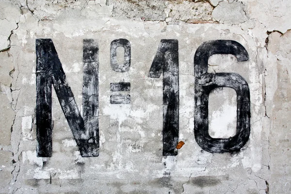 Number sixteen painted on old wall — Stock Photo, Image