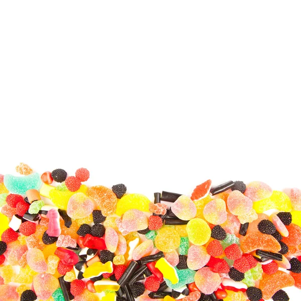 Smíšené barevné cukroví pozadí — Stock fotografie