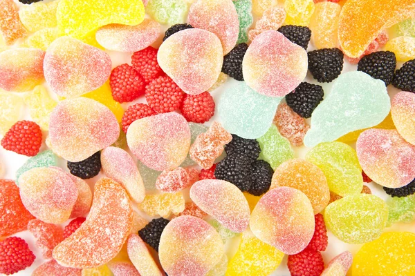 Vegyes színes cukorka háttér — Stock Fotó