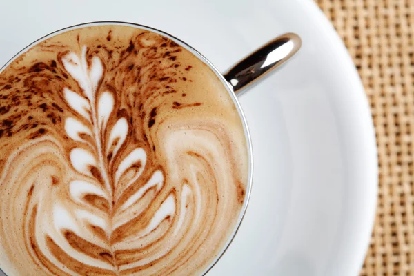 Art latte on a cappuccino coffe cup — Stock Photo, Image