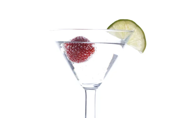 Strawberry floating in a cocktail — Stock Photo, Image