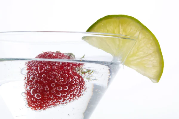 Strawberry floating in a cocktail — Stock Photo, Image