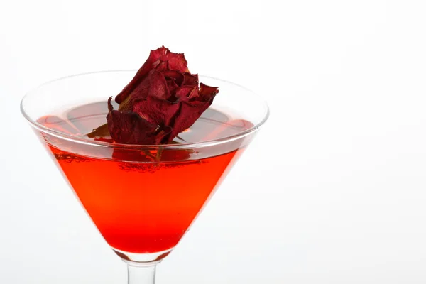 Rose floating in a red liquor — Stock Photo, Image