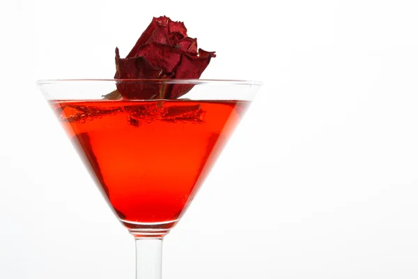 Rose floating in a red liquor — Stock Photo, Image