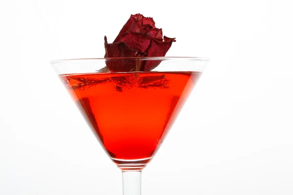 Rose floating in a red liquor — Stock Photo, Image