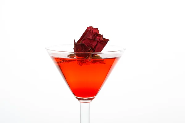 Rose floating in a red liquor — Stock Photo, Image