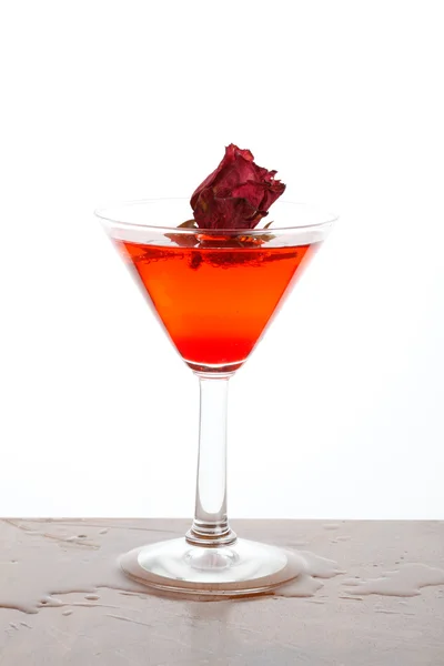 Rose floating in a red liquor — Stock Photo, Image