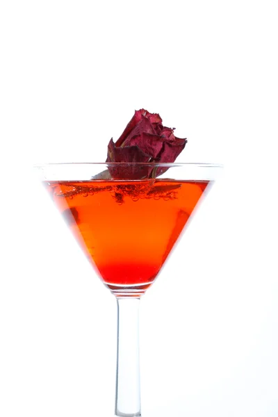 Rose floating in a red liquor — Stock Photo, Image