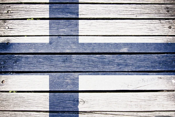 Finlândia, bandeira finlandesa pintada no fundo da prancha de madeira velha — Fotografia de Stock