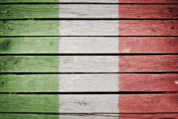 Bandeira italiana pintada no fundo da prancha de madeira velha — Fotografia de Stock