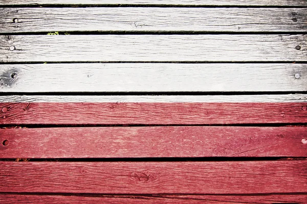 Polsko, polské vlajky na staré dřevěné prkenné pozadí — Stock fotografie