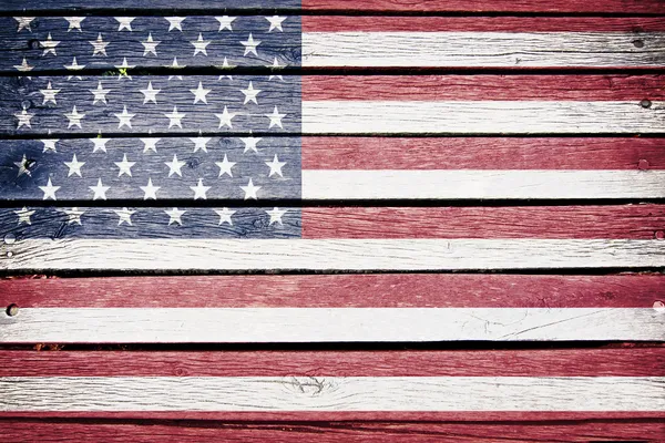 Американський прапор, намальований на старому дерев'яному дошці. Стокове Фото